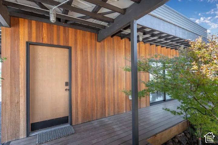 Wood siding facade with a complementary wood-paneled door