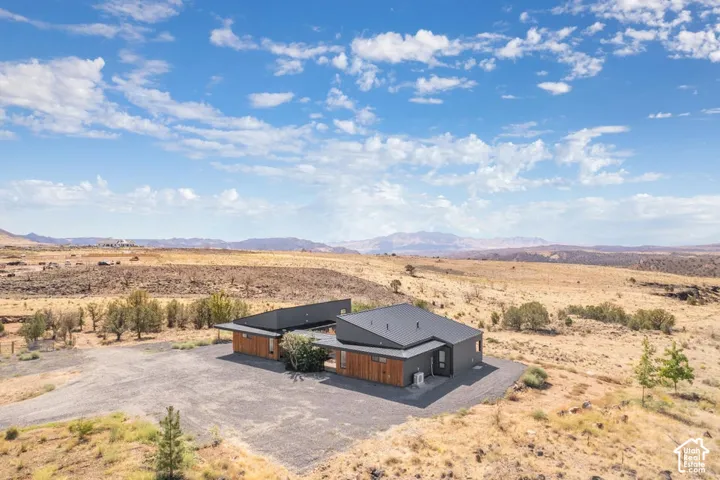 Contemporary architecture with a dark gray exterior and wood-finish siding