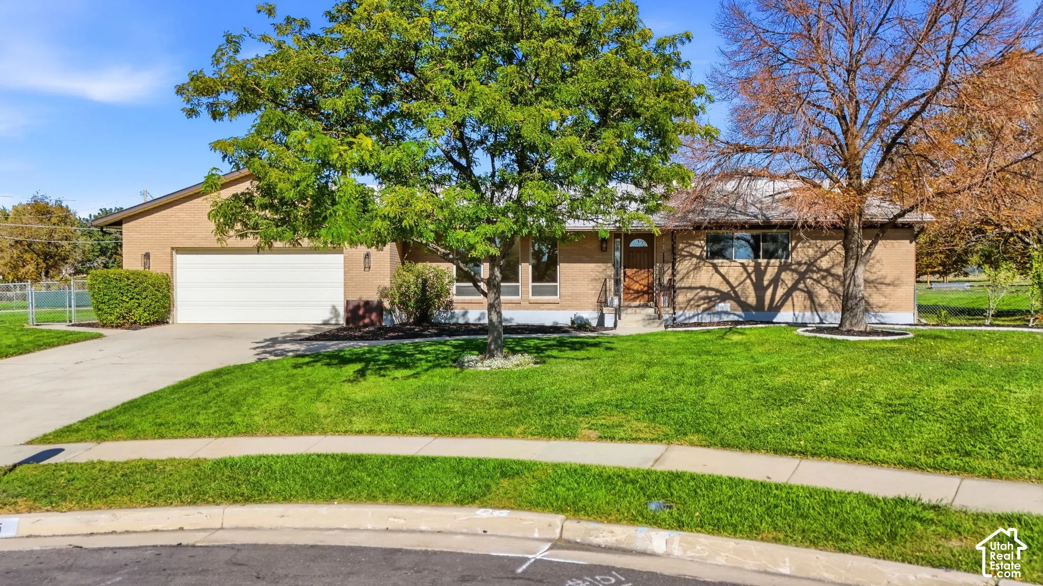 Brick exterior with a prominent two-car garage