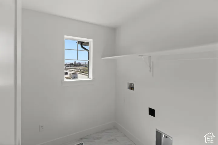Wall-mounted shelving with support brackets, white walls, and a window with horizontal and vertical muntins