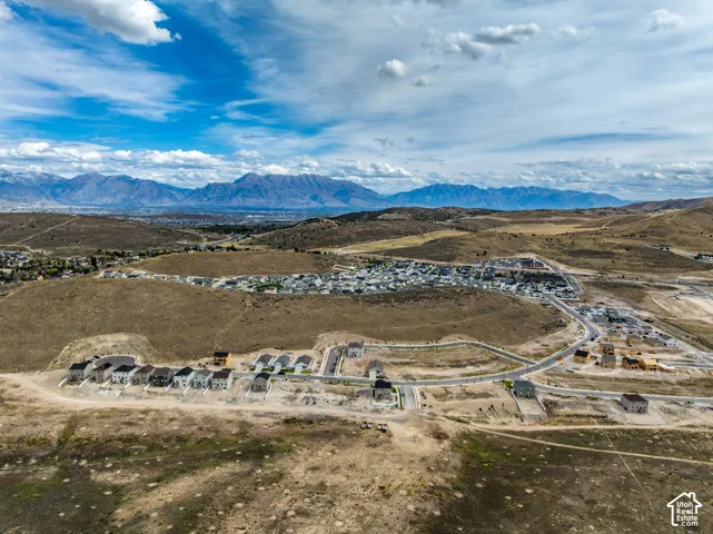 Expansive mountain range backdrop and developing residential community