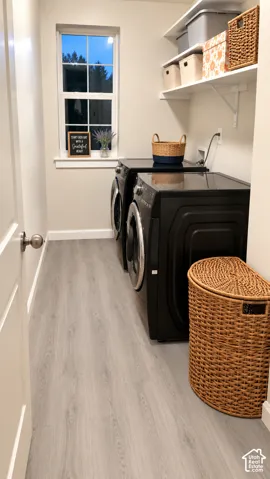 White paneled door with a brushed nickel doorknob, light wood-finish flooring, and white floating shelves