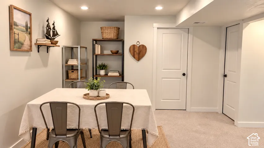 Recessed lighting, wood-finish shelving, and light-colored walls