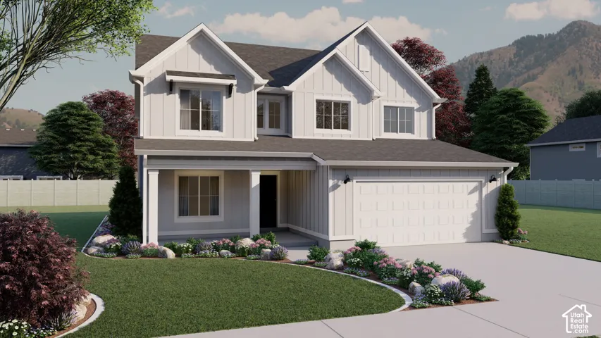 Contemporary two-story residence featuring light gray siding, a prominent two-car garage, and an inviting covered porch