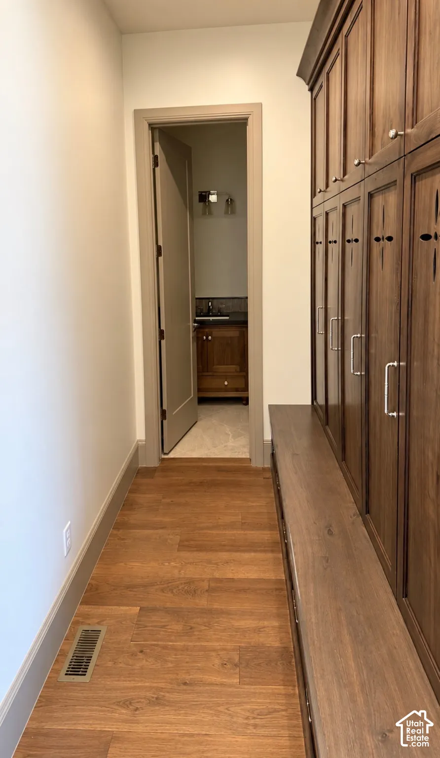 Wood-finish flooring with a contrasting baseboard