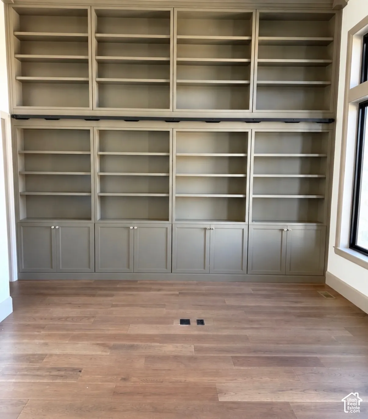 Built-in shelving with integrated base cabinetry and upper display units