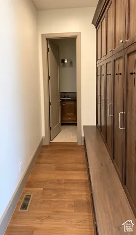 Wood-finish flooring with a contrasting baseboard