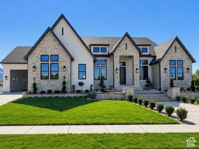 Stone and stucco exterior with multiple gables