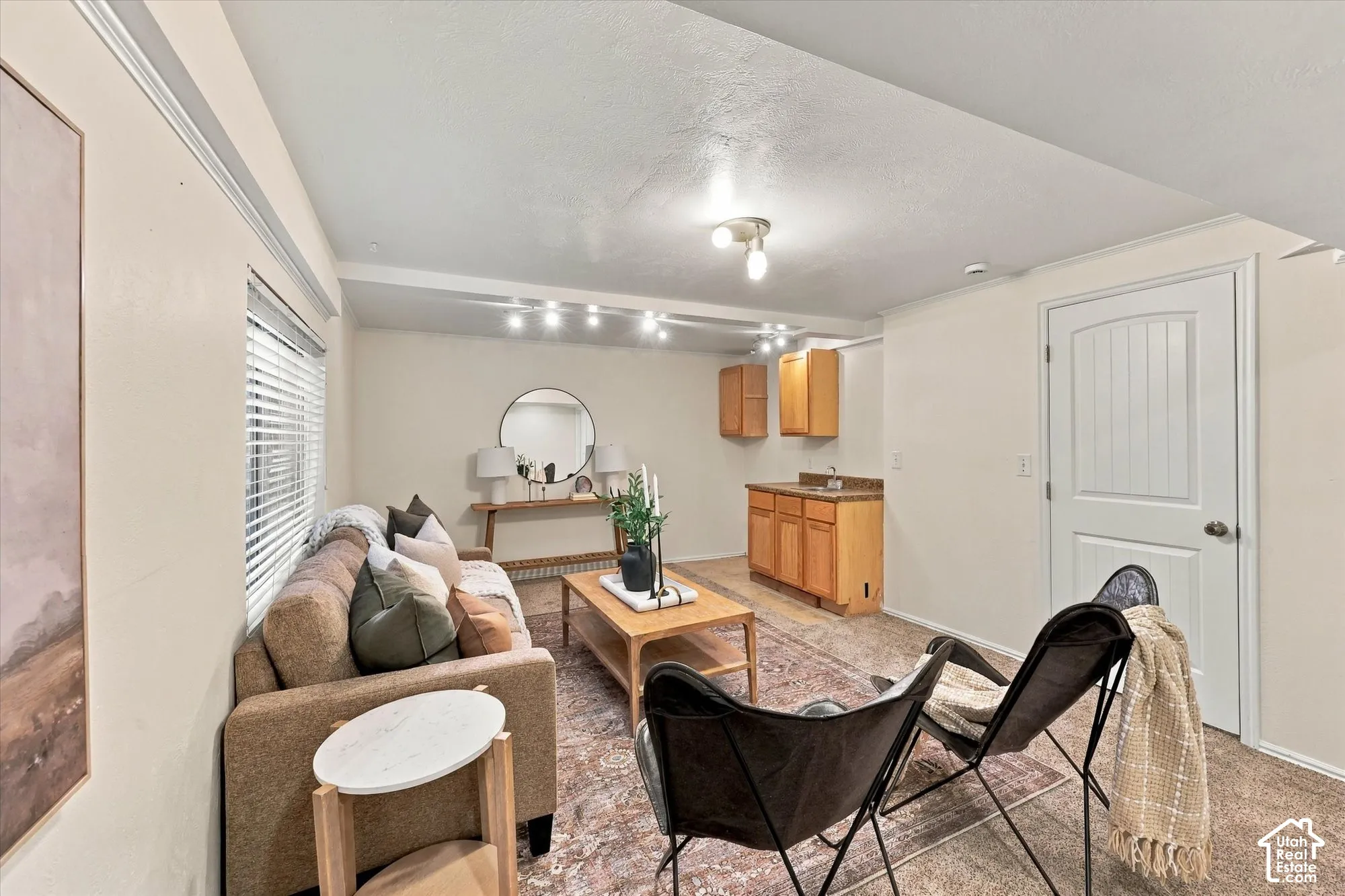 Basement room with new paint and built-in wet bar