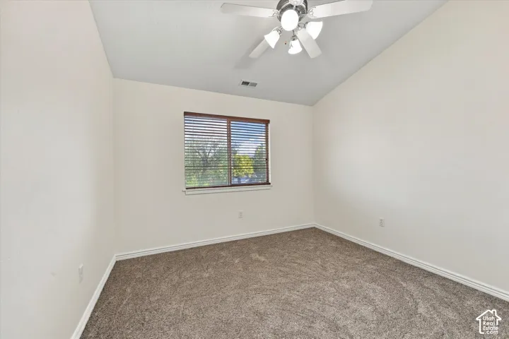 Bedroom with new paint and new carpet, a ceiling fan, and a built-in closet
