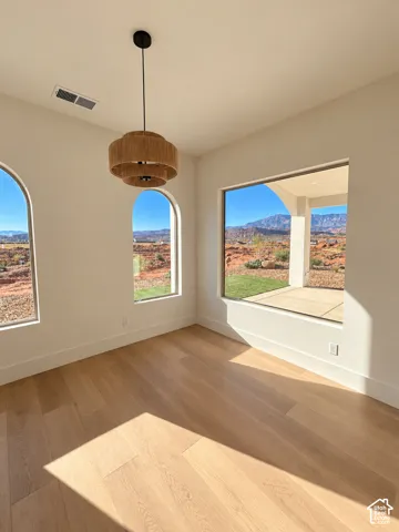 Light wood-finish flooring with white walls