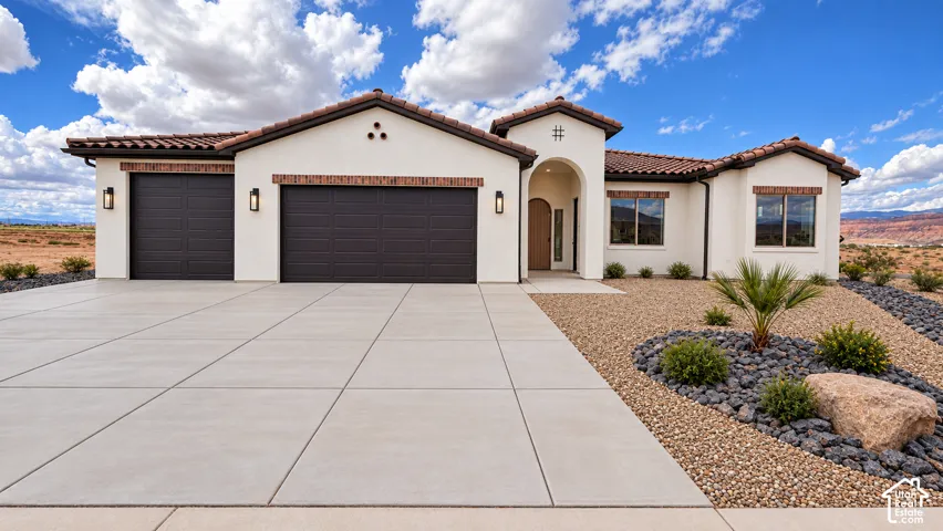 White stucco exterior with a tiled roof