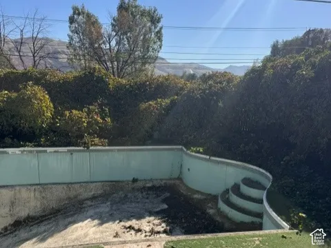 In-ground pool featuring integrated steps and perimeter decking
