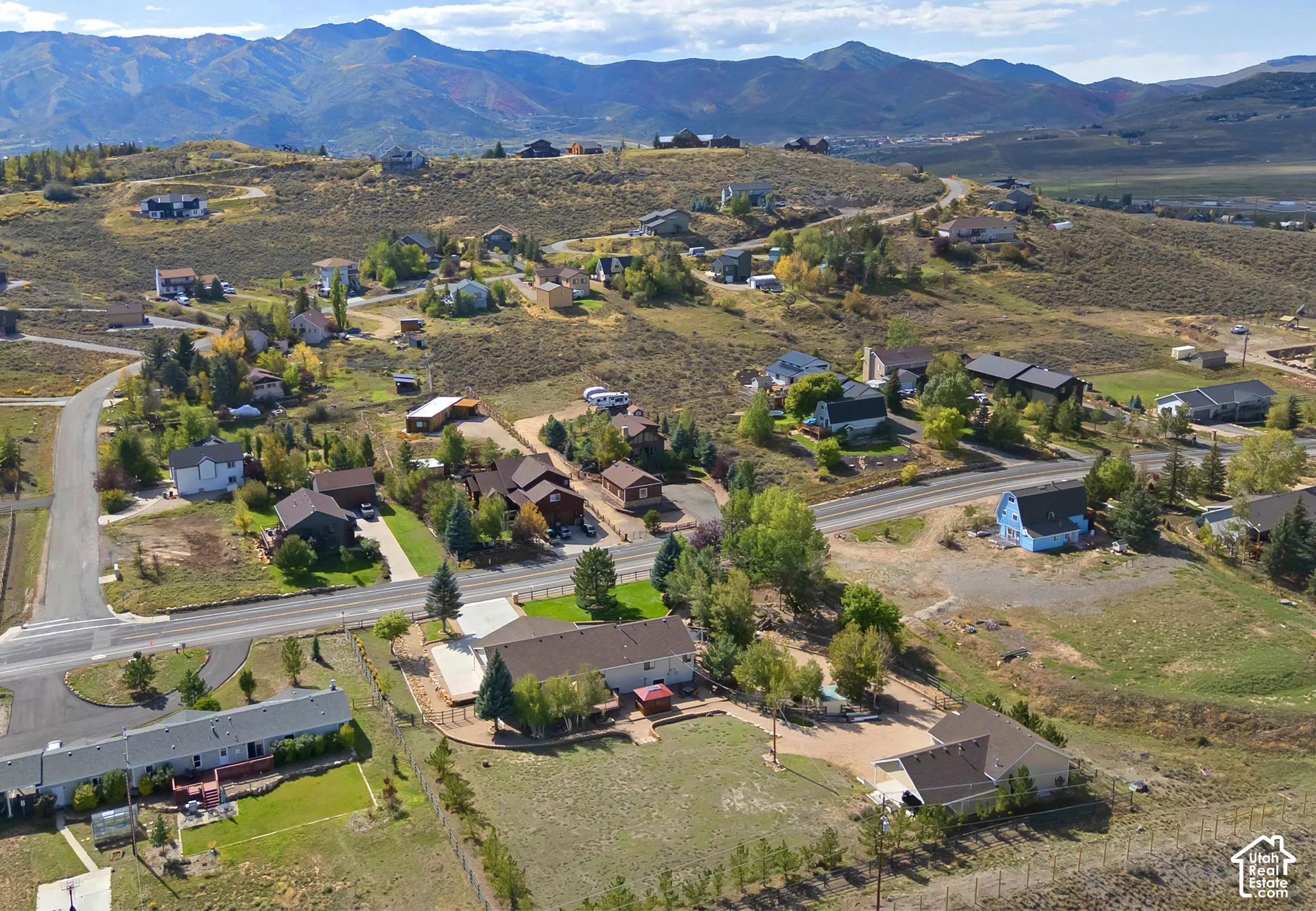 Expansive mountain backdrop with a scattered residential development