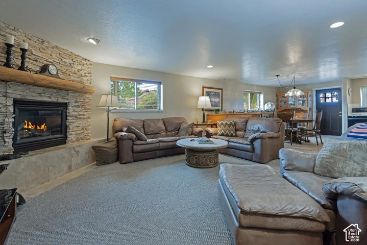 Stone-clad fireplace with a substantial timber mantle