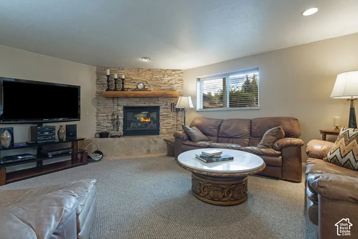 Stone-clad fireplace with a wood mantel