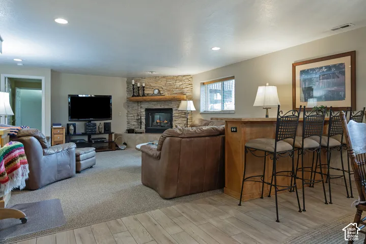 Stone-faced fireplace with a substantial wood mantel