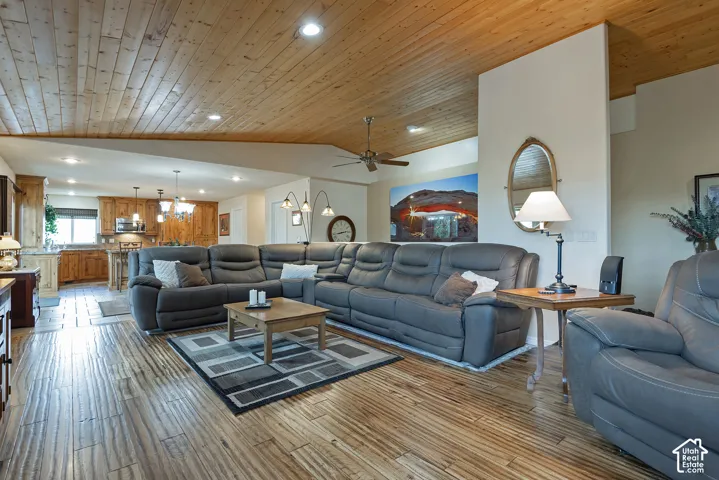 Wood-finish flooring throughout, complemented by a wood-plank ceiling with recessed lighting