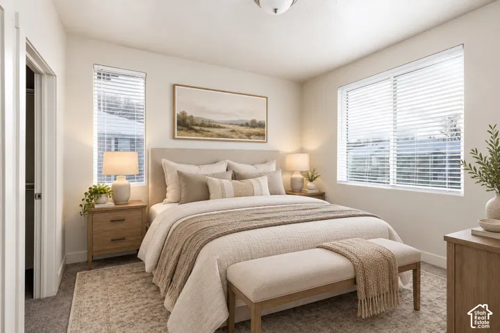 Recessed lighting, light-toned carpeting, multiple windows with blinds, a built-in closet, and light-toned walls