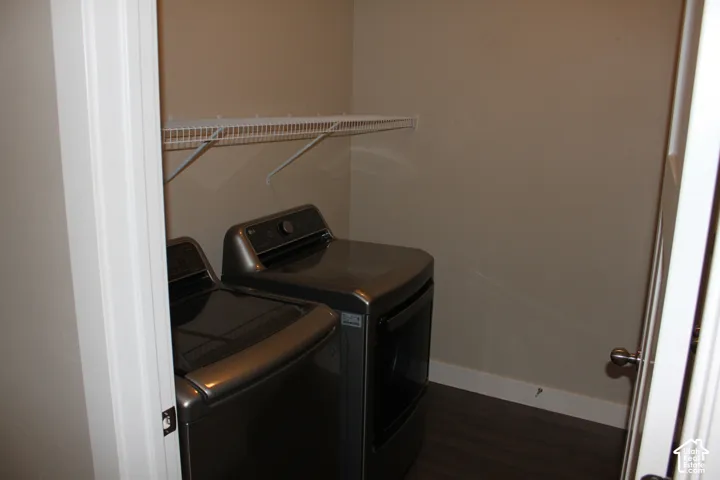 Laundry closet with wire shelving and wood-finish flooring