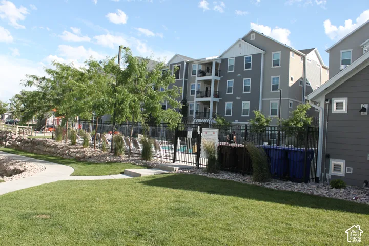 Manicured lawn area with a winding concrete pathway