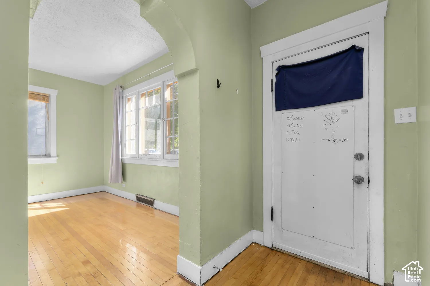 Wood-finish flooring with an arched doorway