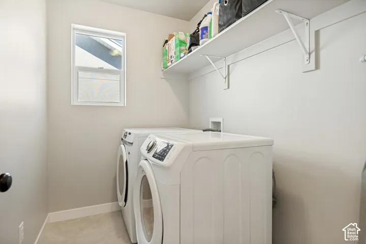 Wall-mounted shelving with white brackets, white-framed window, and light-toned flooring