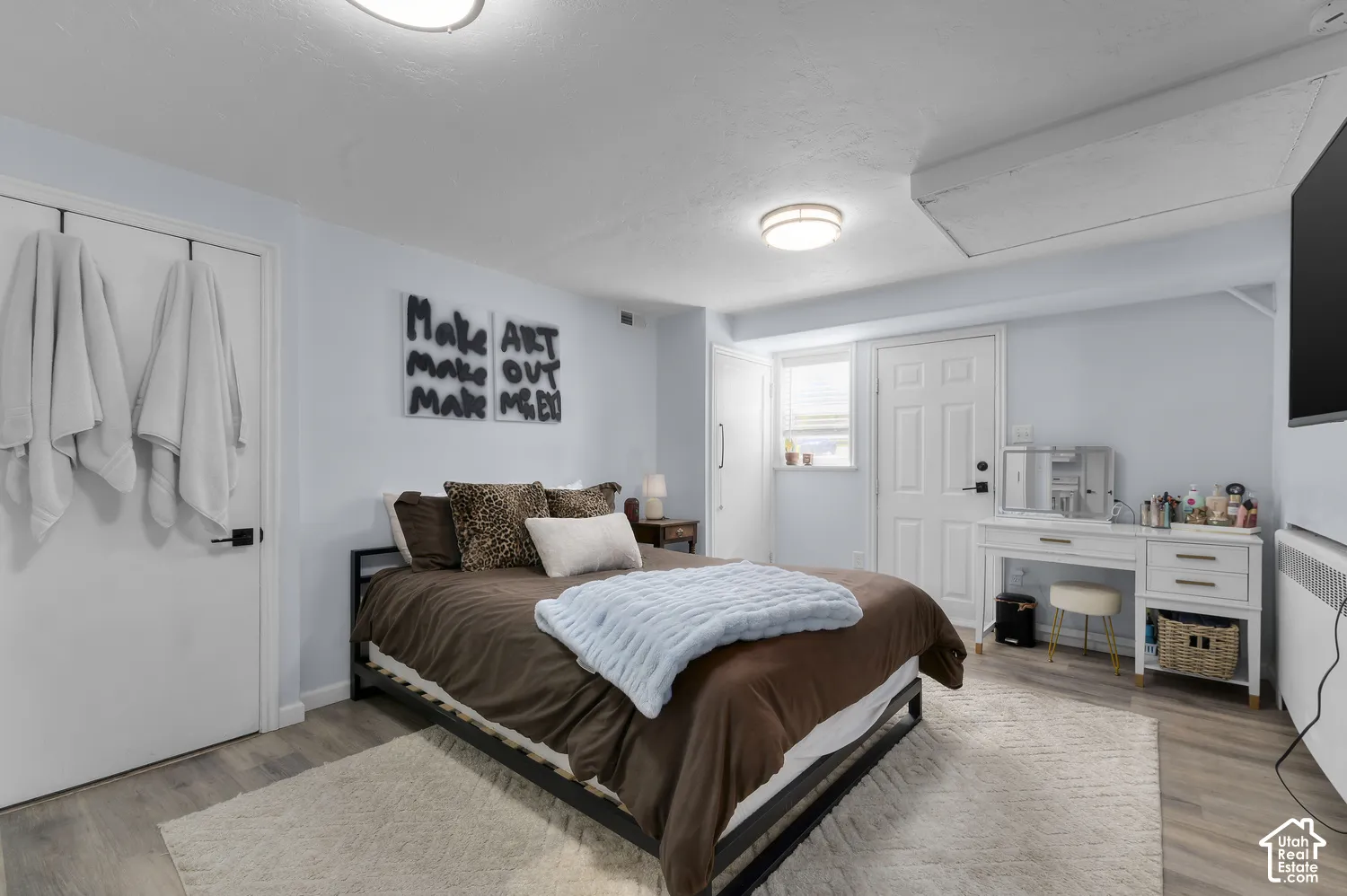 Light-toned walls complement wood-finish flooring