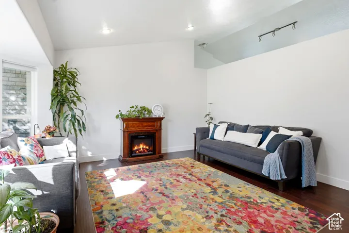 Recessed lighting, wood-finish flooring, and a built-in fireplace