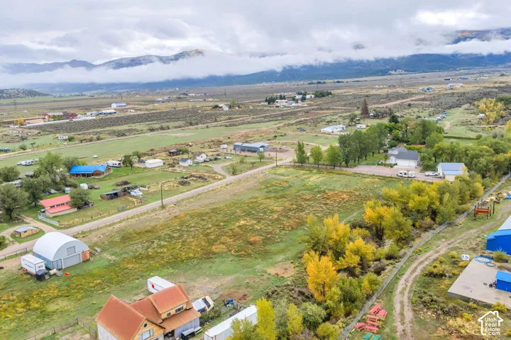 Expansive land parcel featuring open fields and distant mountain views