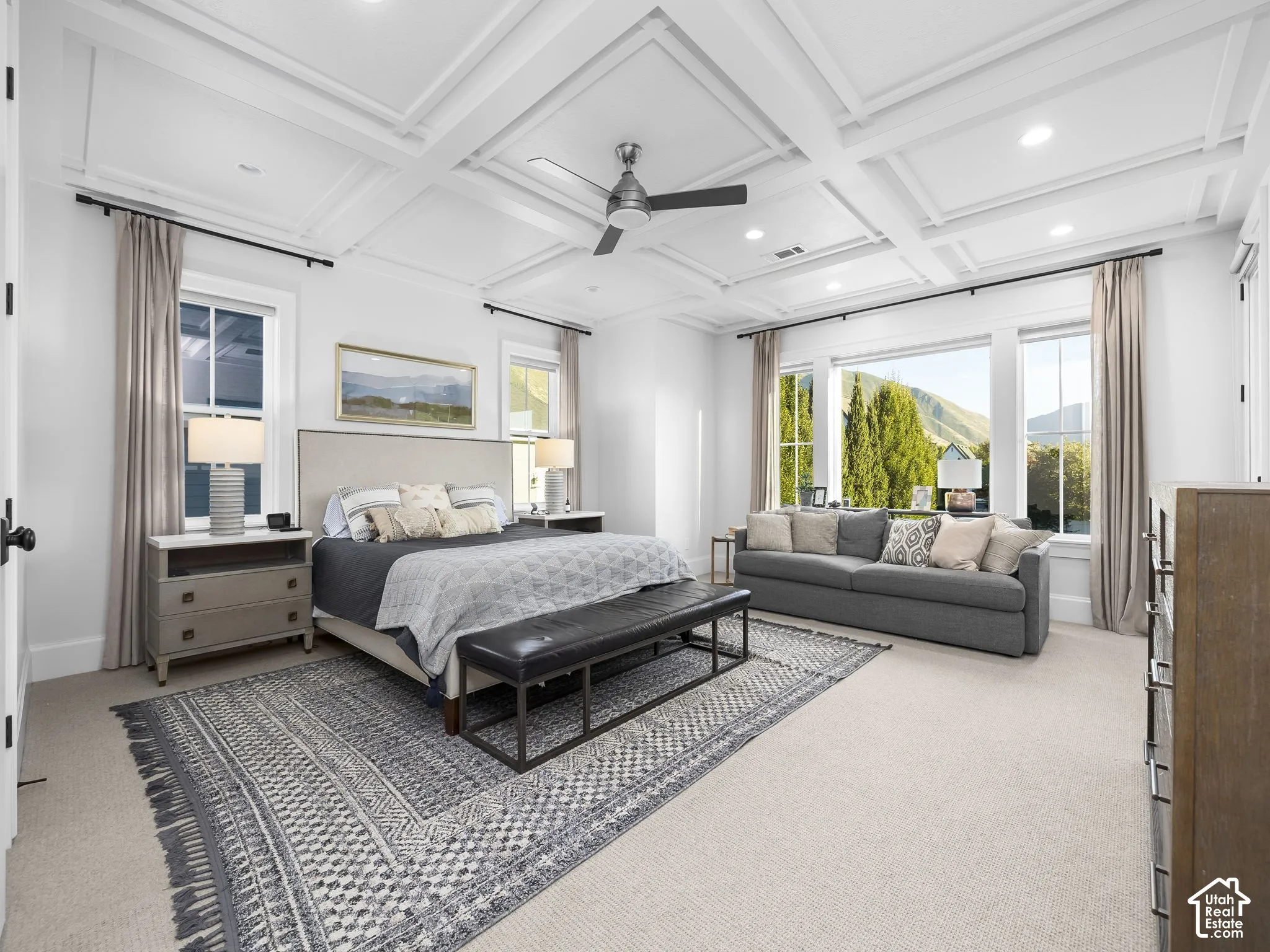 Coffered ceiling with recessed lighting and ceiling fan