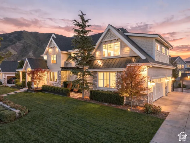 Stone and siding exterior with gabled roof lines