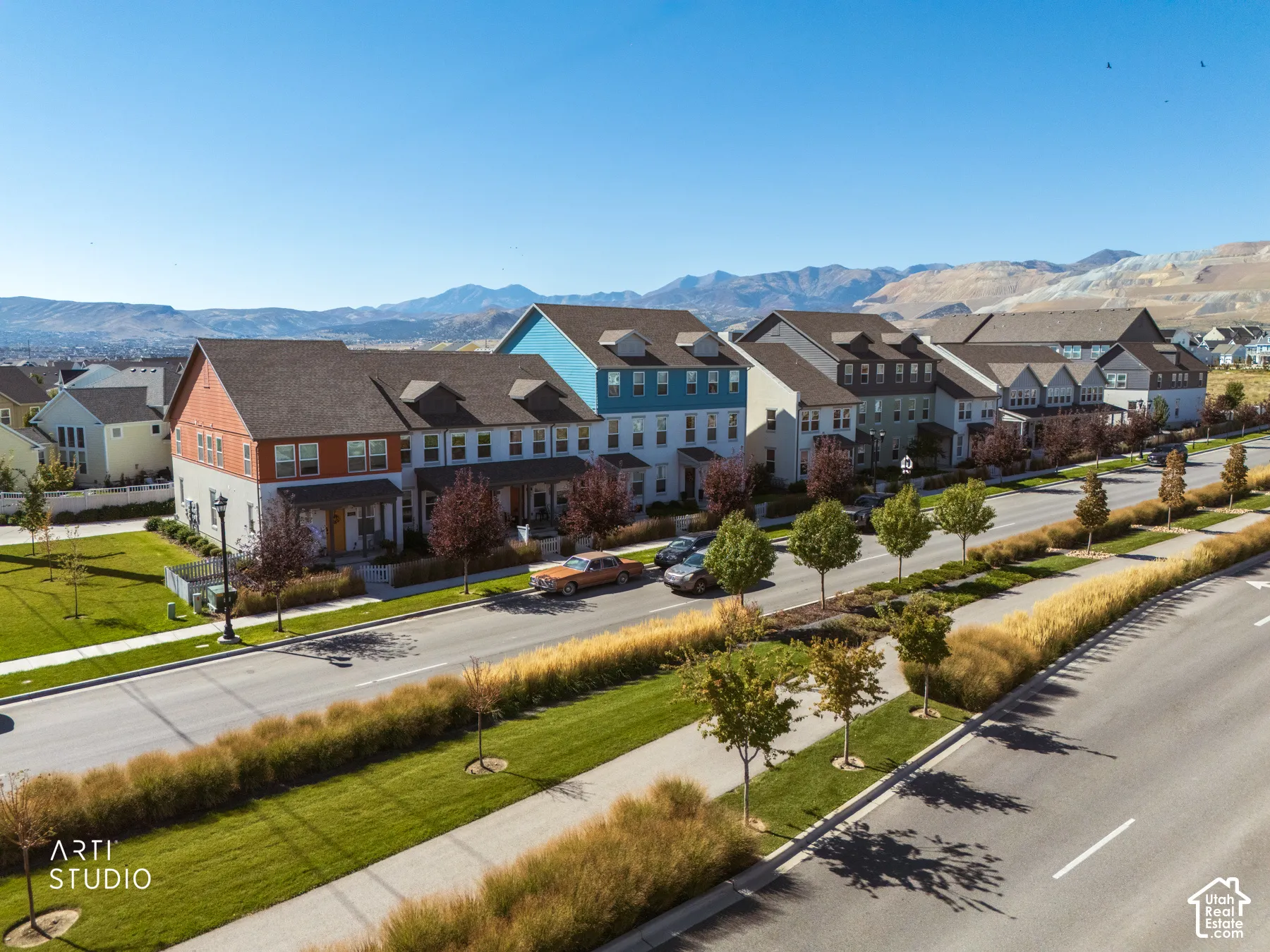 Contemporary multi-story residences featuring varied exterior finishes and dormer windows