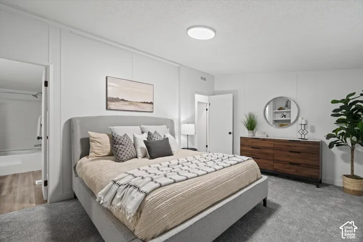 Large primary bedroom with new plush carpet.
