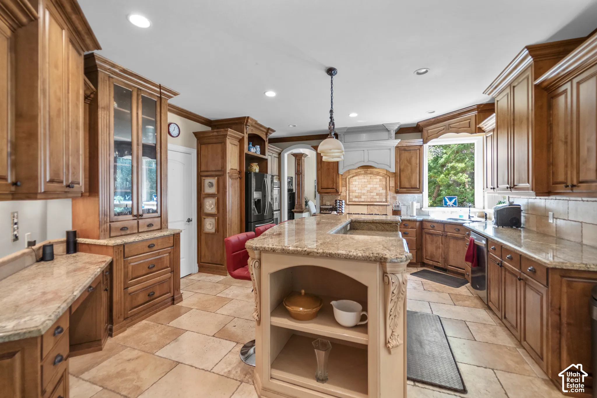 The gorgeous kitchen is warm and inviting and plenty large for all your chefs needs and entertainers heart. With granite countertops, high end gas range, and a central island you will love preparing dinner for a quiet night at home or for guests.