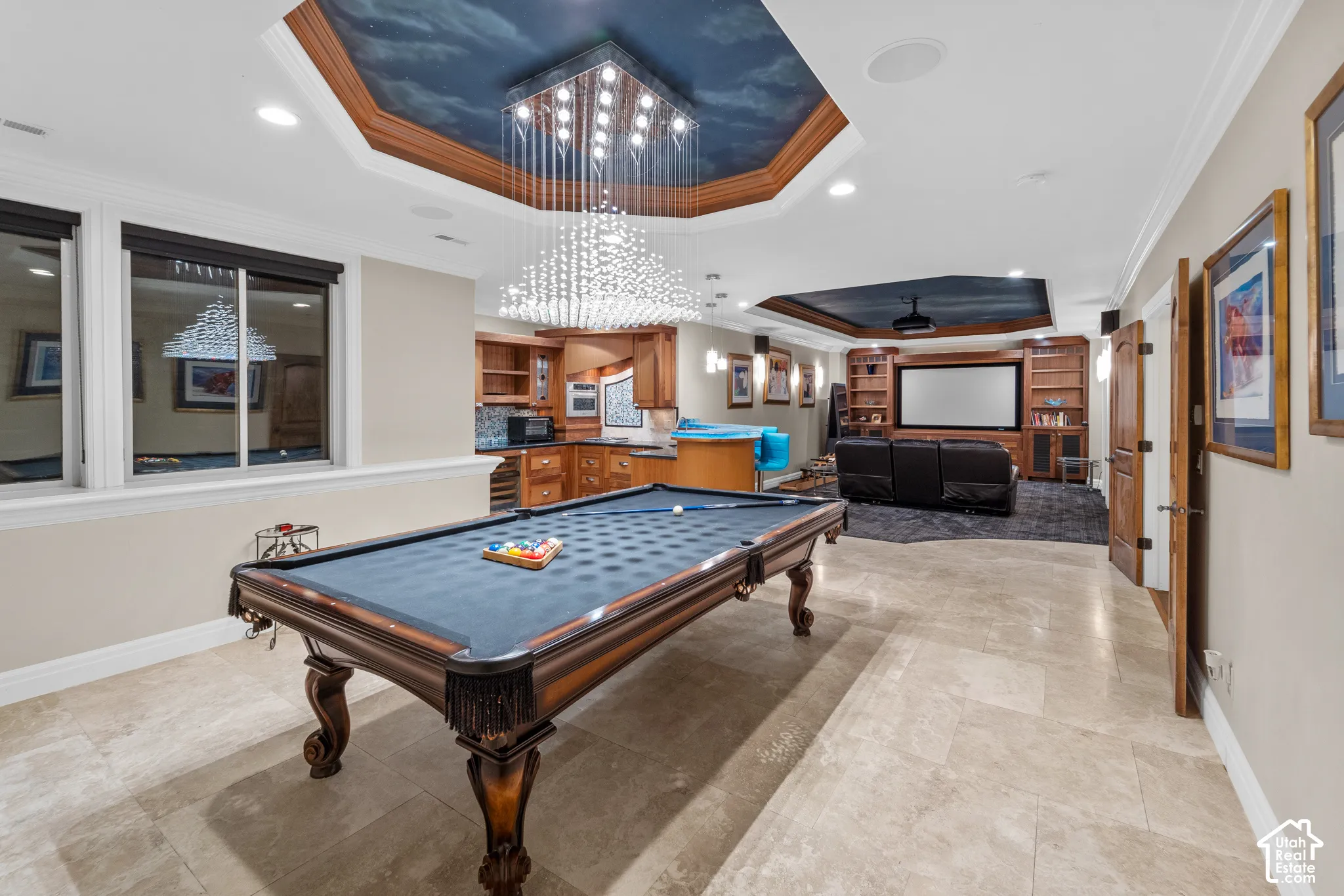 The recreation room has a gorgeous coffered, hand painted ceiling and the chandelier itself is art.