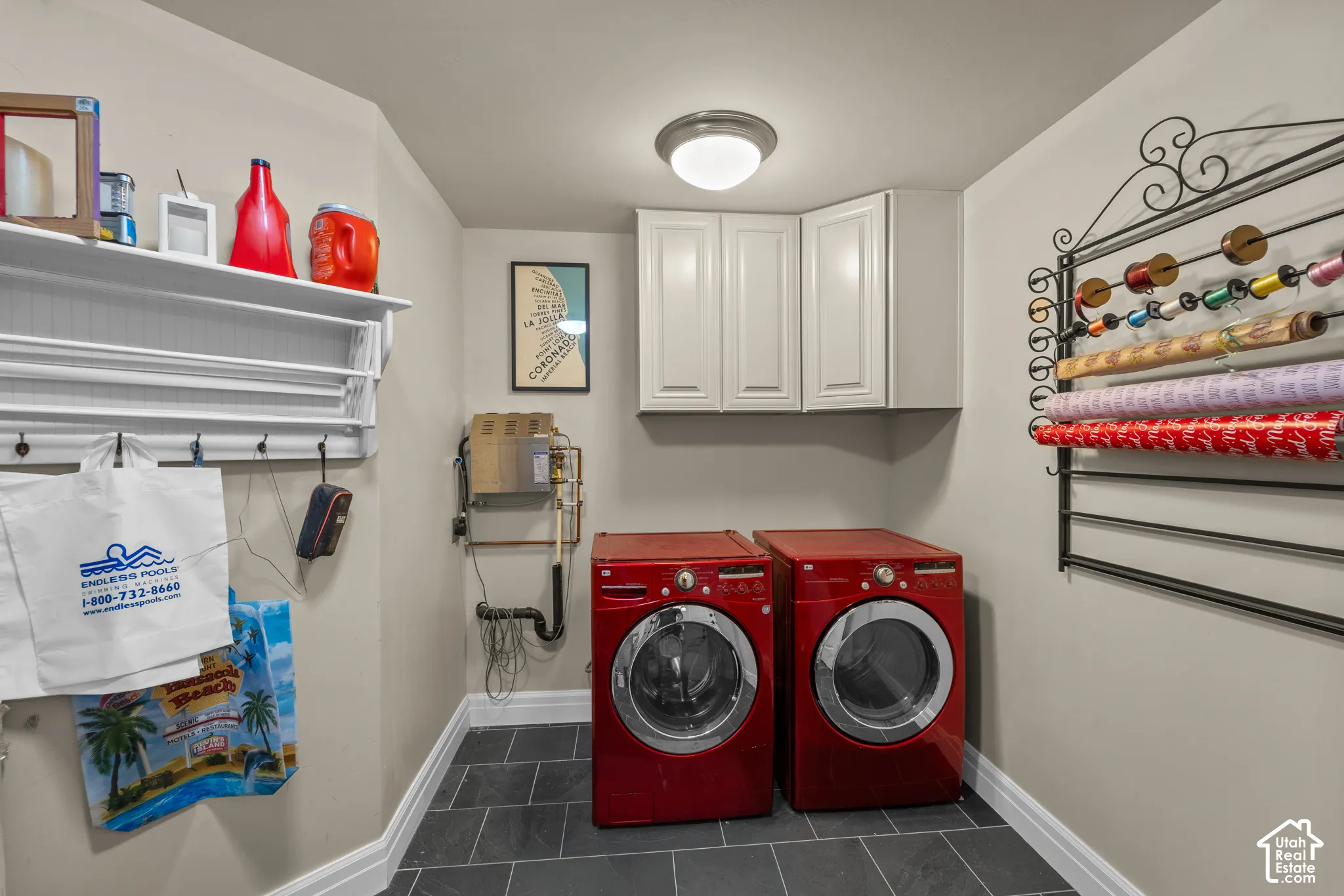 This is the second laundry room in this home. There is plenty of storage in the room and the steam unit for the shower is easily accessible right by the washer.