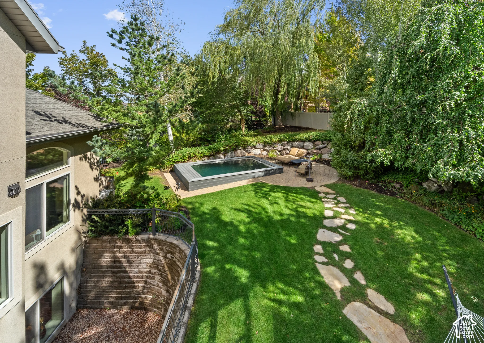 Looking down from the primary bedroom at the beautiful, extremely private backyard.