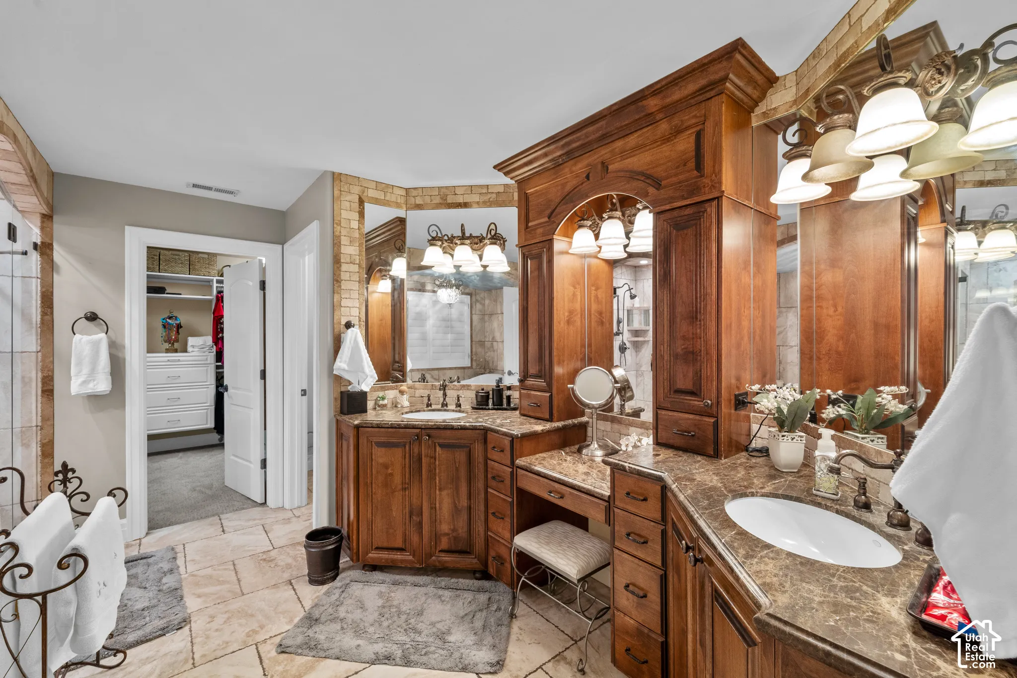 Dual vanity with beautiful cabinetry, integrated sinks, and plenty of space to get ready for your day.