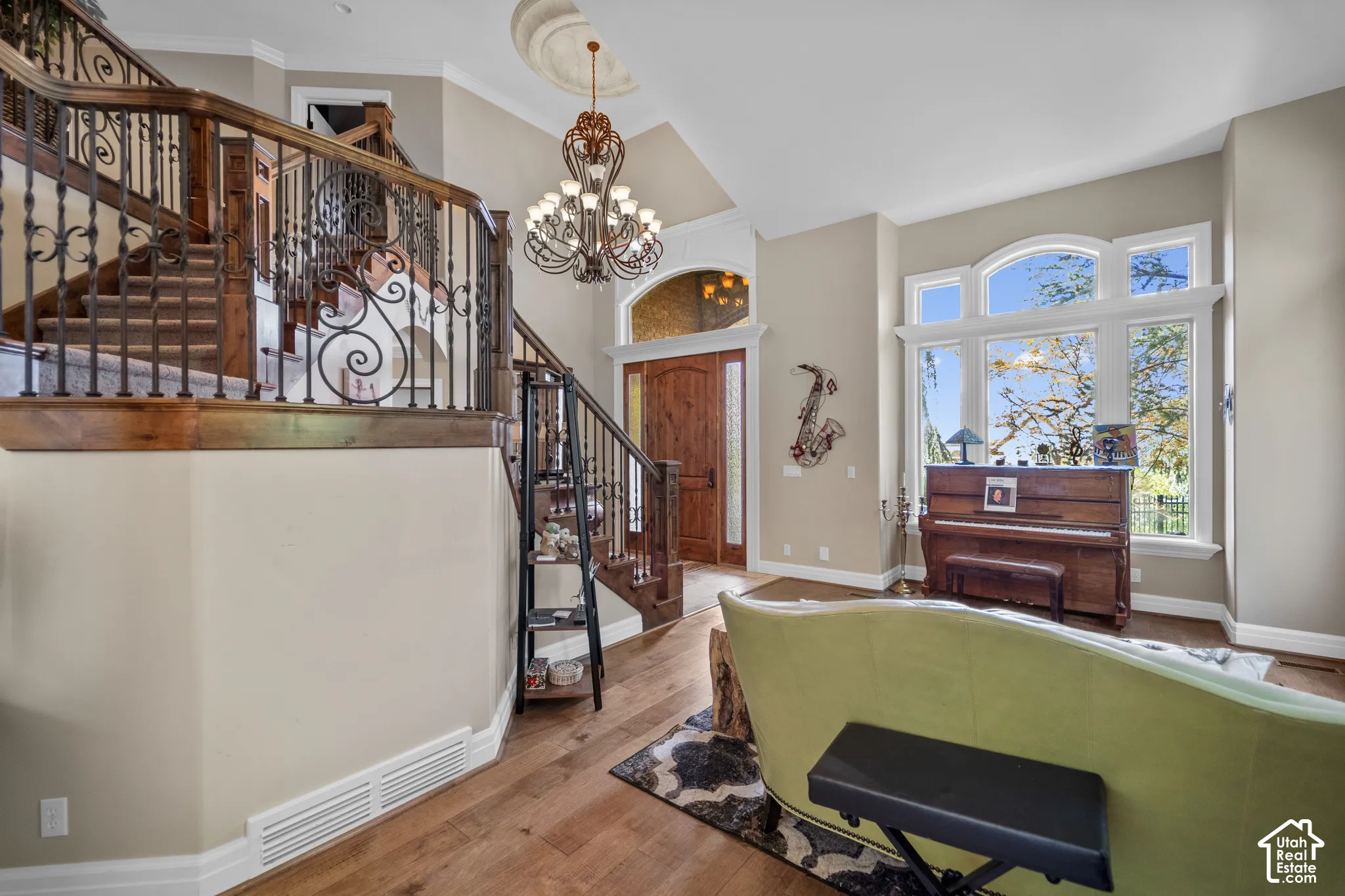 Dramatic arched windows, and souring ceilings bring in lots of bright light into the formal living room.