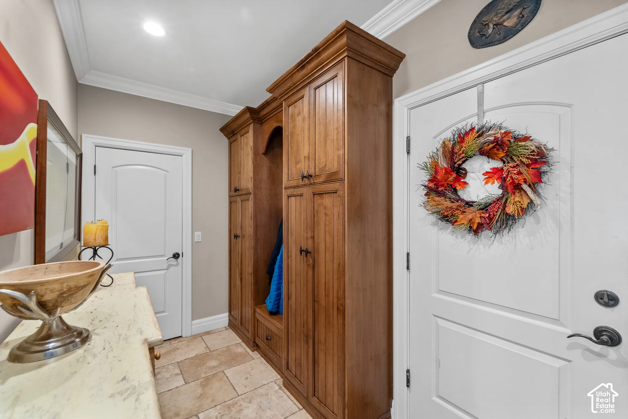 Located just inside the home from the garage, this space offer a tidy place to hang your coats, take off your shoes and get ready to relax at home.