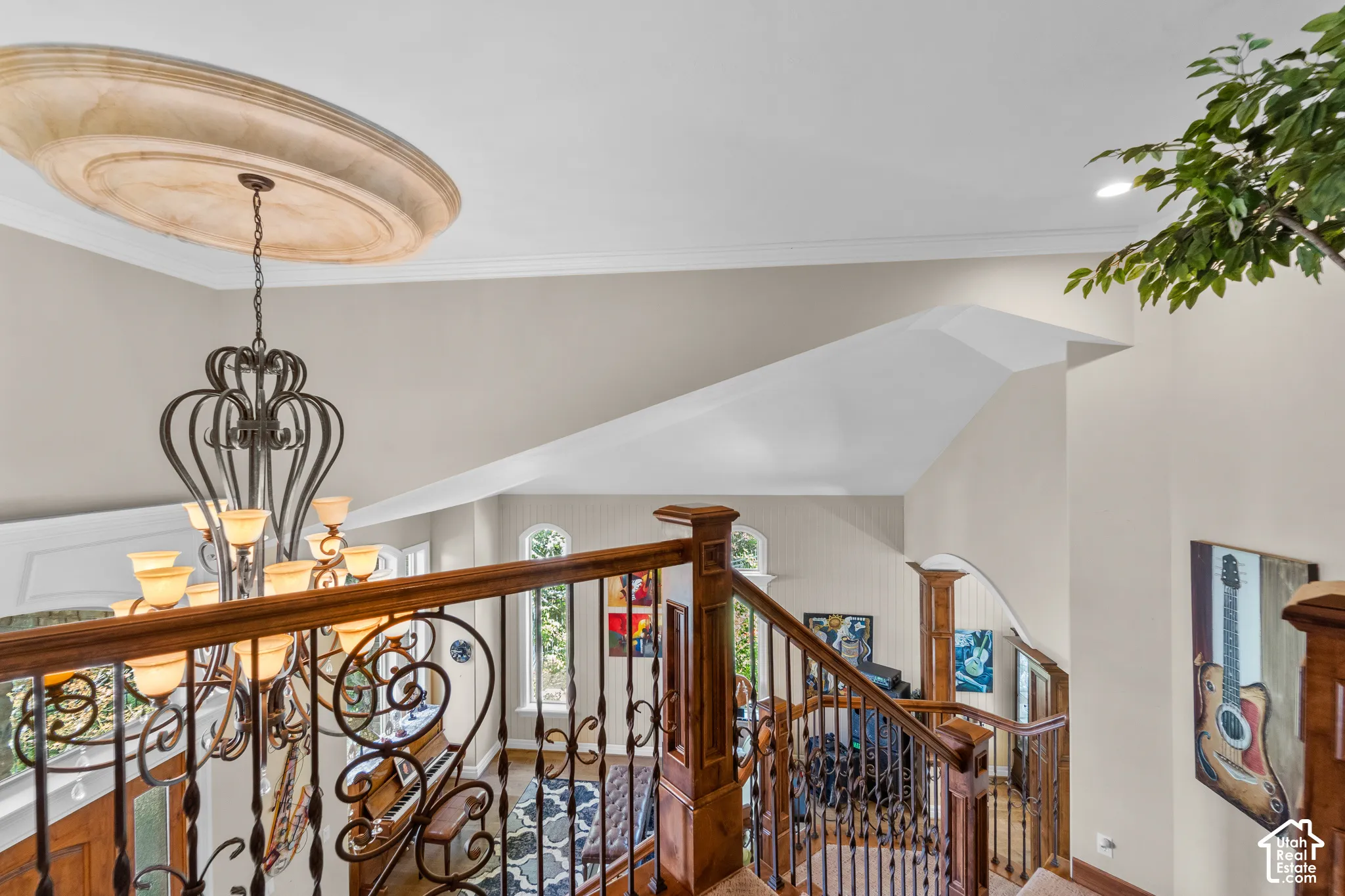 Looking from the top of the stairs down, make sure you notice all the custom finishes like the ceiling medallion and woodwork.