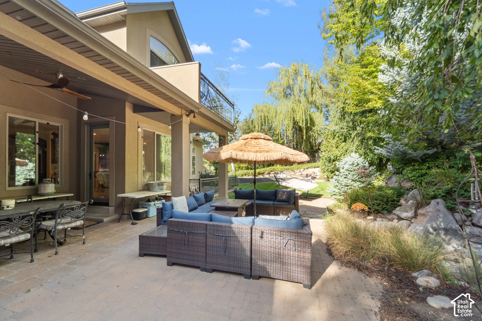 Expansive paver patio with a covered outdoor living area, coustom outdoor kitchen giving another amazing space for a peaceful family dinner or entertaining guests. This back yard has been used for weddings, graduation, high school reunions and more. Just