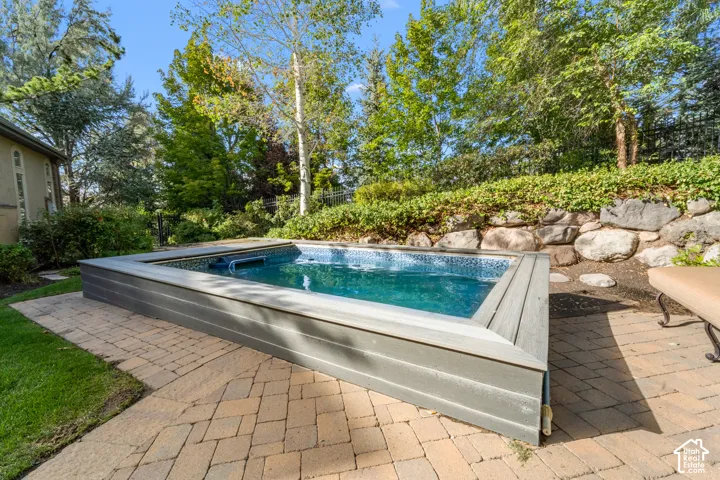Not just a pool this one has a treadmill and water jet for endless swimming or walking. There is also built in seating because life is also about relaxing. This yard is so private you will feel comfortable just relaxing and letting the world pass by.