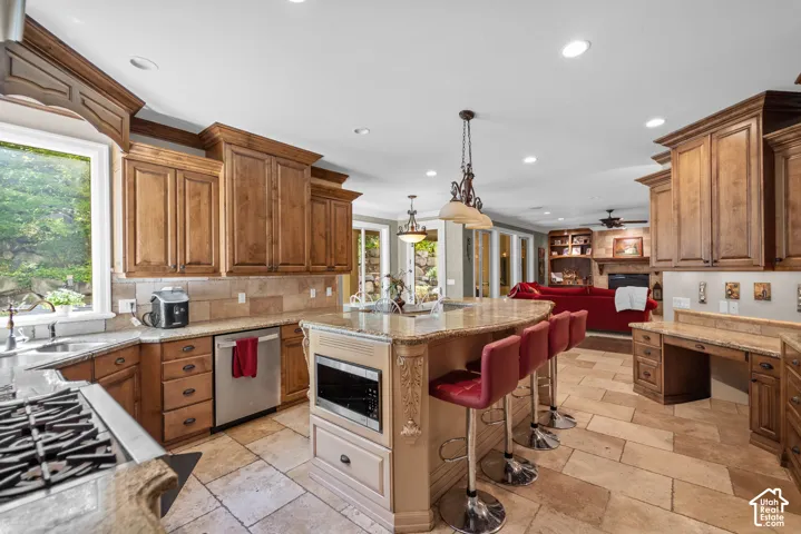Thoughtful finishes like a built in microwave, huge pantry and plenty of cabinetry keep the countertops clutter free.