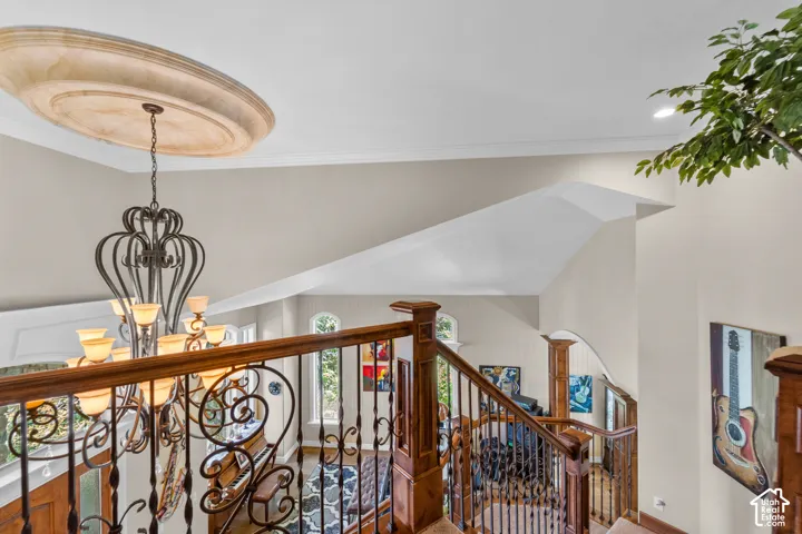 Looking from the top of the stairs down, make sure you notice all the custom finishes like the ceiling medallion and woodwork.
