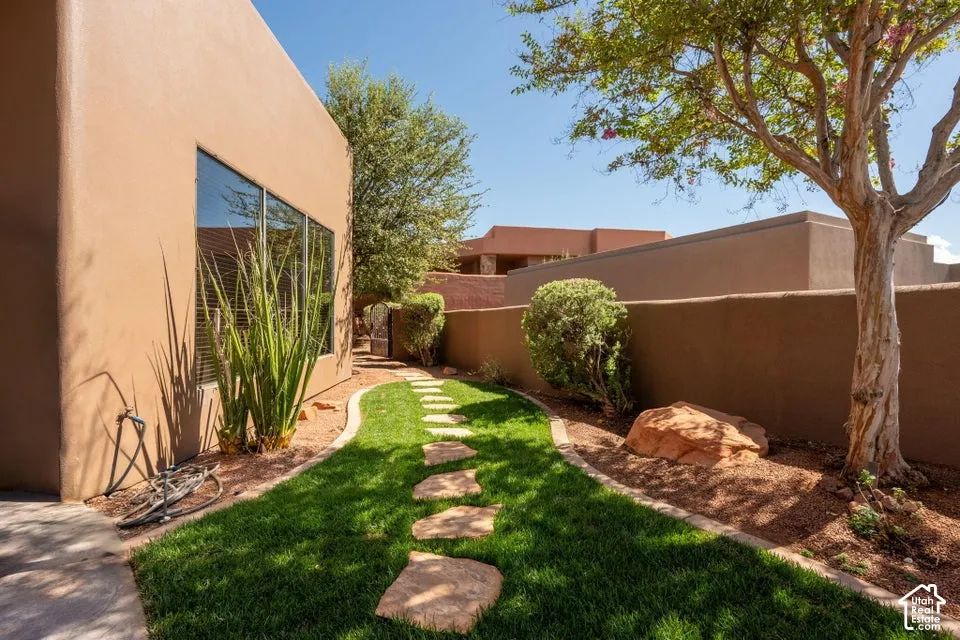 Expansive stucco exterior with large picture windows