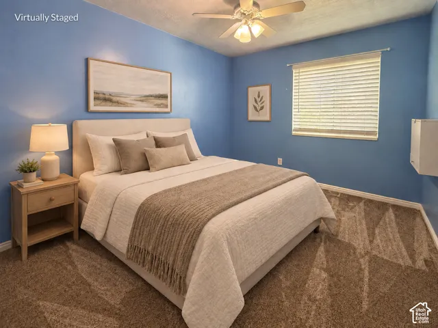 Plush carpeting, a ceiling fan with integrated lighting, a window with blinds, and white trim