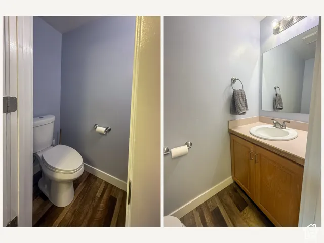 Powder room featuring wood-finish flooring, a contemporary vanity with a built-in sink, and a rectangular wall mirror