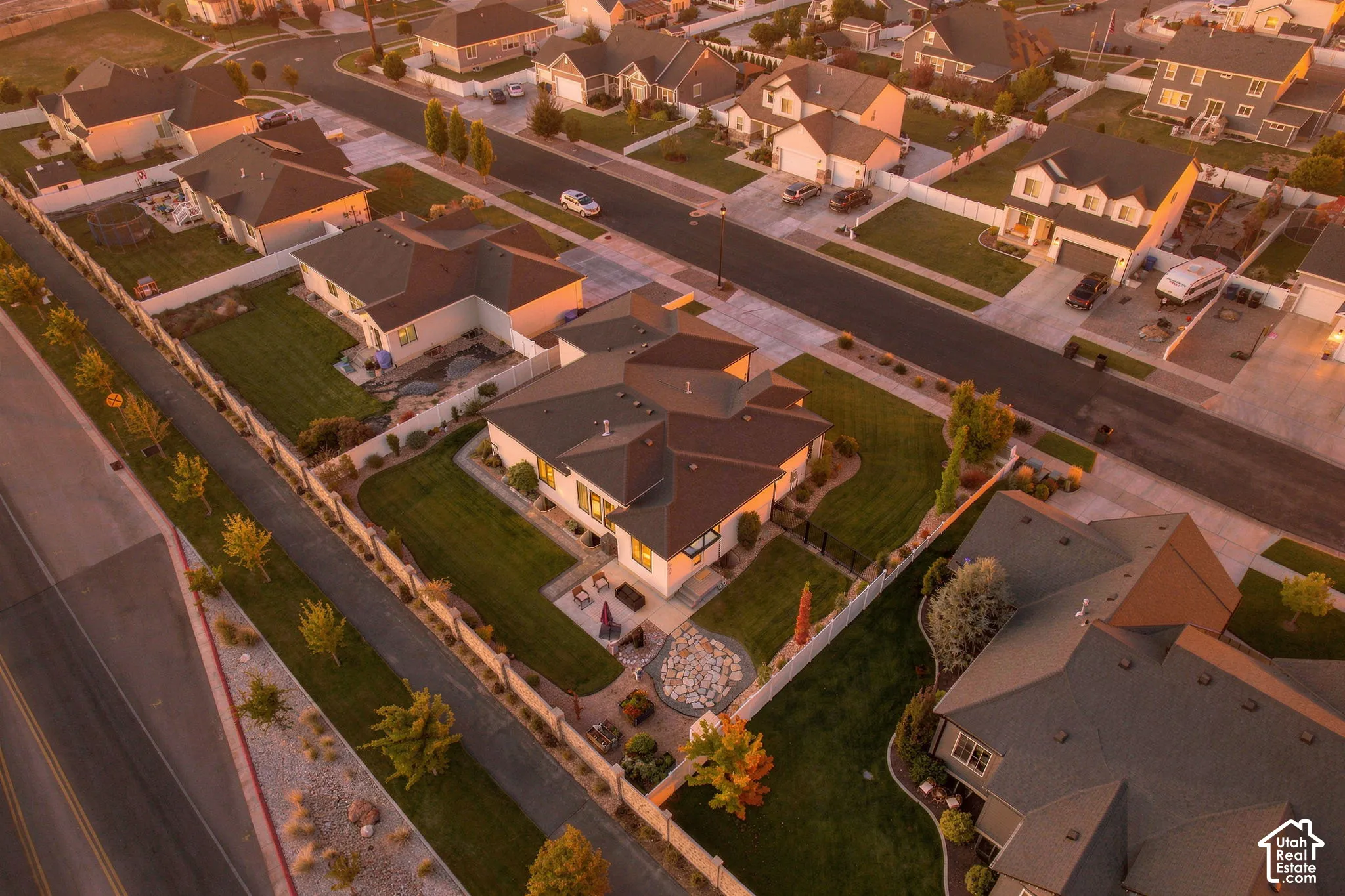 Expansive residential setting with multiple single-family homes, featuring paved streets and sidewalks